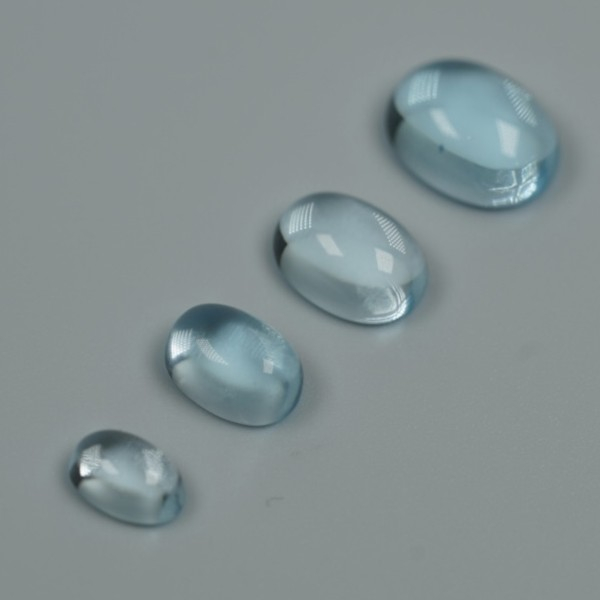 sky-blue-topaz-6x4-7-5x5-8x6-9x7-cabochon-oval-bundle-of-4